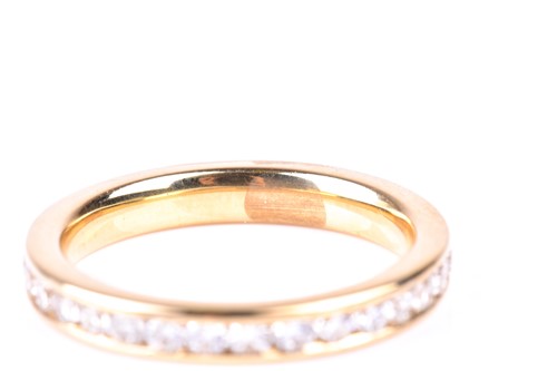 Lot 473 - A full hoop diamond eternity ring, the round...