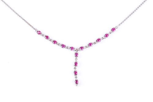 Lot 509 - A diamond and ruby pendant necklace, the V...