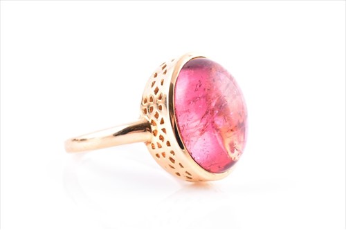 Lot 710 - An 18ct yellow gold and tourmaline ring set...