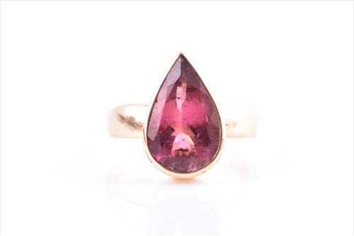 Lot 711 - A 9ct yellow gold and pink tourmaline ring set...