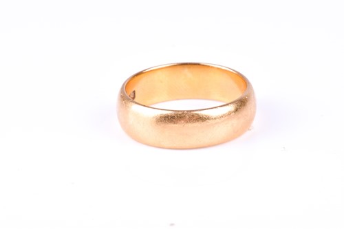 Lot 413 - A 22ct yellow gold wedding band, of plain...