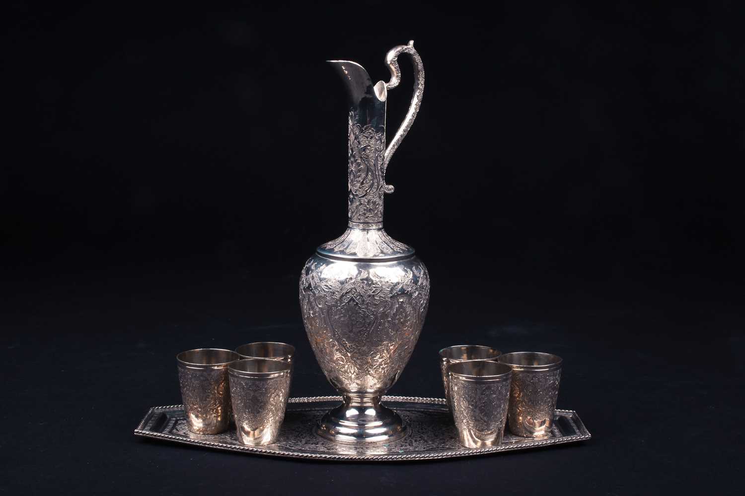 Lot 5 - An Eastern white metal ewer, with six...