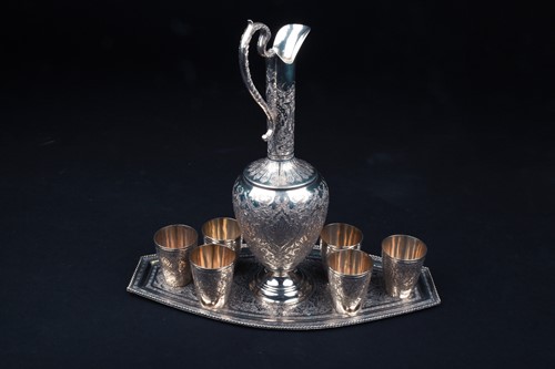 Lot 5 - An Eastern white metal ewer, with six...