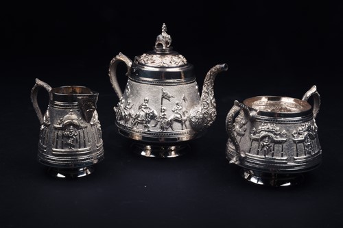 Lot 36 - An Indian white metal three-piece teaset and...