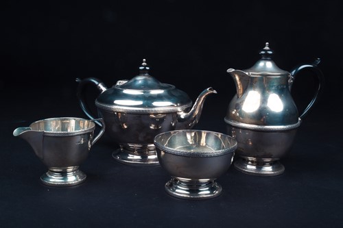 Lot 6 - A George V silver four-piece tea set,...