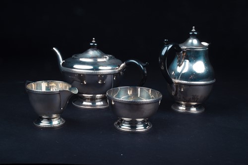 Lot 6 - A George V silver four-piece tea set,...