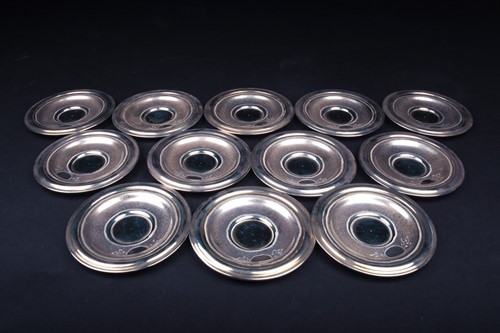 Lot 34 - A set of twelve Syrian silver dowry cups and...
