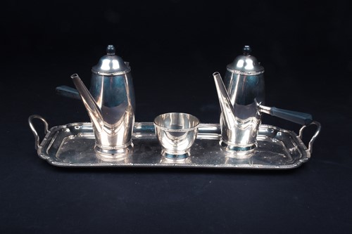 Lot 663 - A pair of George V silver chocolate pots, on...