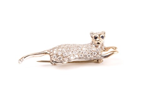 Lot 700 - A diamond and sapphire cat brooch, in the form...