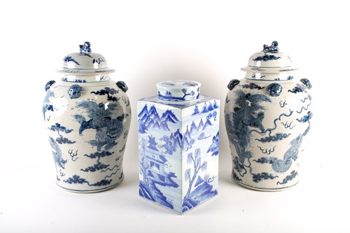 Lot 232 - A pair of Chinese Shi shi vases and covers,...