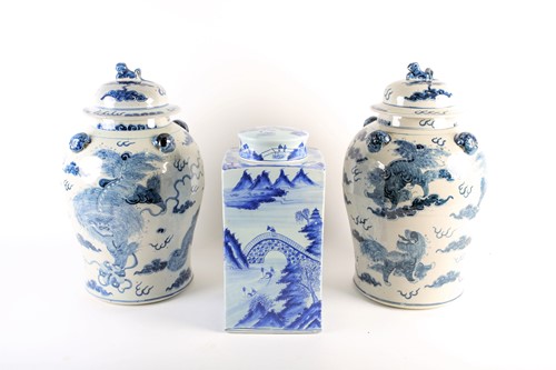 Lot 232 - A pair of Chinese Shi shi vases and covers,...