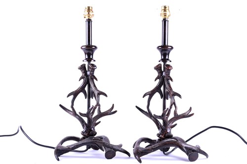 Lot 465 - A pair of metalware table lamps, modelled as...