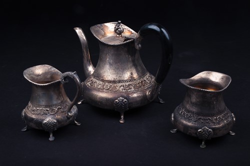 Lot 77 - A Continental white metal three-piece teaset,...
