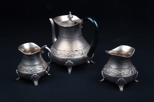 Lot 166 - A Continental white metal three-piece teaset,...