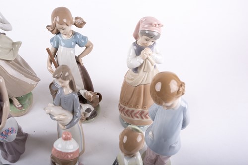 Lot 329 - A group of twelve assorted Lladro porcelain...