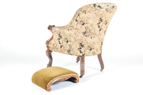 Lot 162 - A Victorian armchair and footstool, mid 19th...