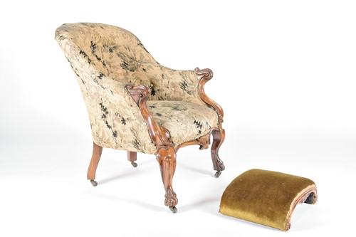 Lot 162 - A Victorian armchair and footstool, mid 19th...
