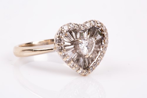 Lot 824 - An 18ct white gold and diamond heart-shaped...