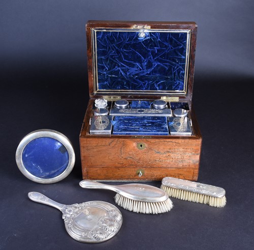 Lot 628 - A matched silver-backed dressing table set,...