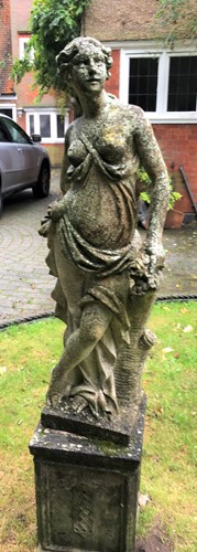 Lot 384 - A reconstituted stone garden statue emblematic...