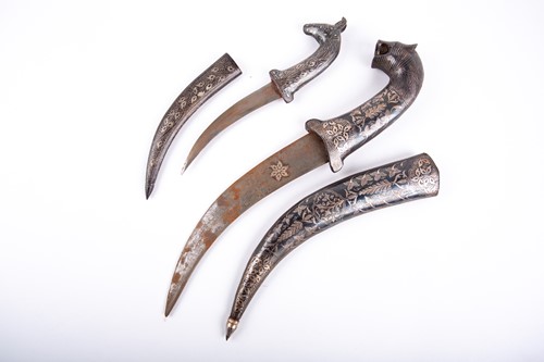 Lot 290 - Two Persian dress daggers, each with niello...