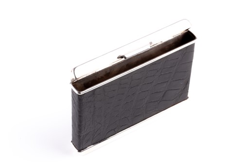 Lot 305 - Cartier. A silver cigarette case with black...