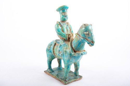Lot 308 - A Persian Kashan pottery equestrian figure,...