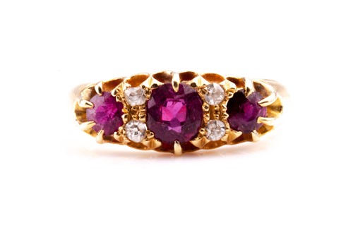 Lot 479 - A yellow metal, diamond, and ruby ring, set...
