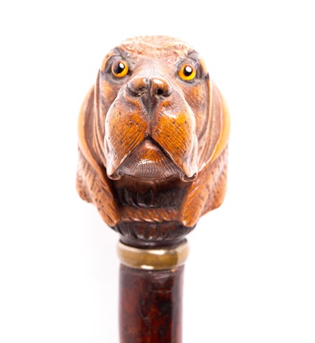 Lot 409 - A Black Forest carved wood dog's head walking...