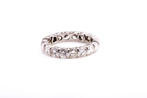 Lot 788 - A diamond eternity ring, set with seventeen...