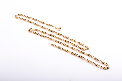 Lot 693 - A yellow metal flattened Figaro link chain...