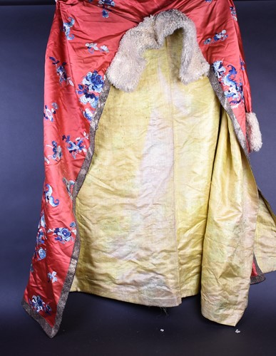 Lot 217 - A Chinese silk embroidered winter jacket, Qing,...