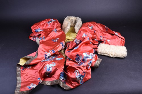 Lot 217 - A Chinese silk embroidered winter jacket, Qing,...