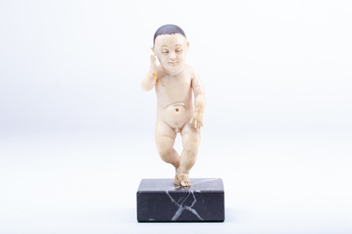 Lot 393 - An Indo Portuguese ivory figure of a boy, 17th...