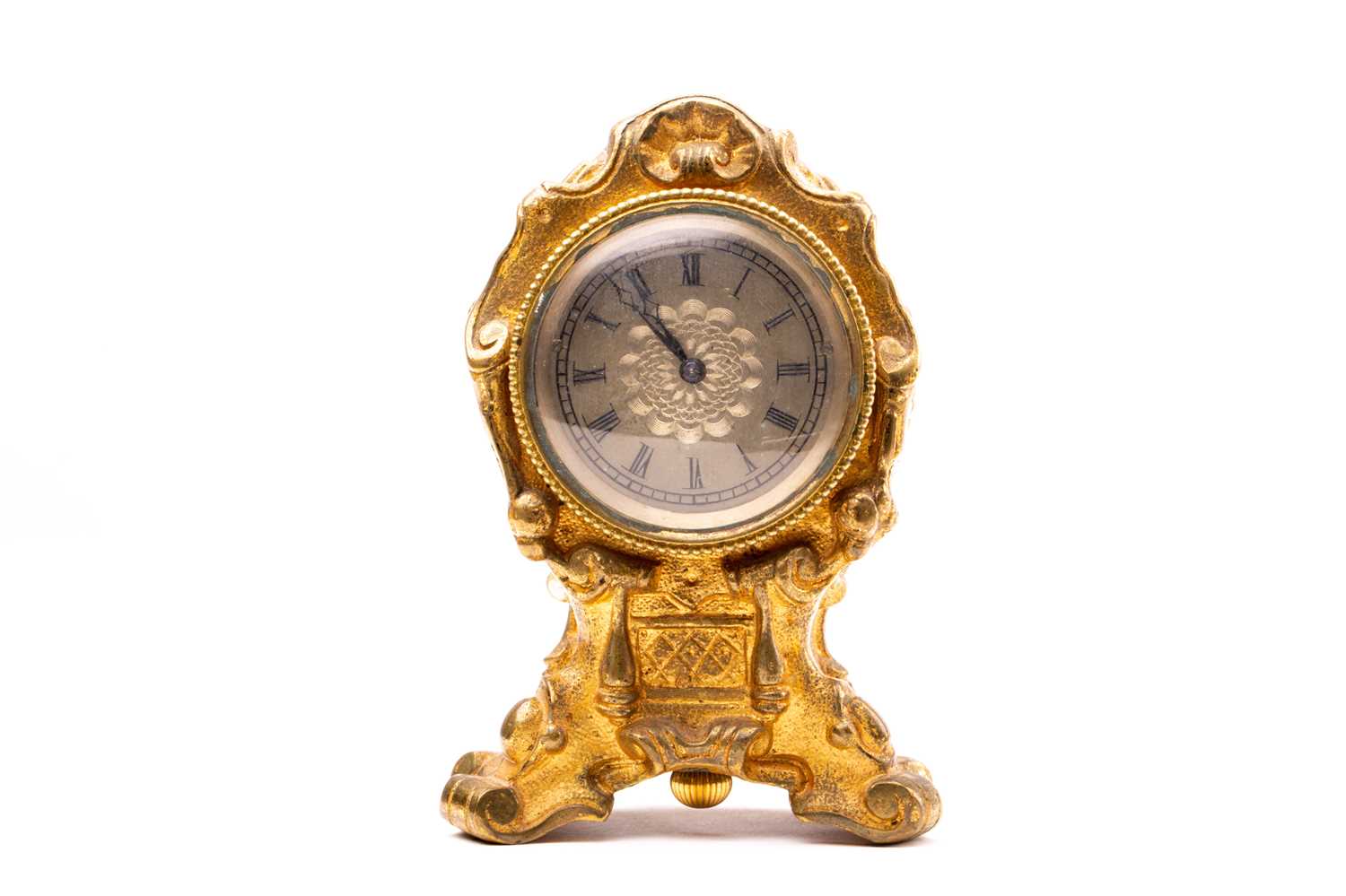 Lot 533 - A 19th century gilt metal desk clock, in the...