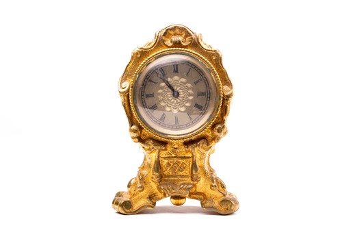 Lot 533 - A 19th century gilt metal desk clock, in the...