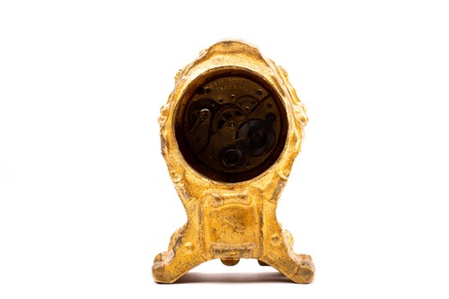 Lot 533 - A 19th century gilt metal desk clock, in the...