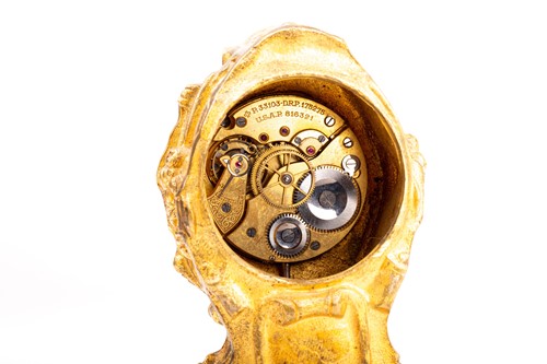 Lot 533 - A 19th century gilt metal desk clock, in the...