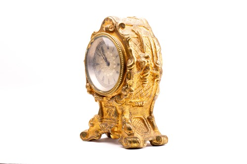 Lot 533 - A 19th century gilt metal desk clock, in the...