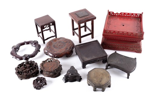 Lot 269 - A collection of Chinese carved hardwood stands,...