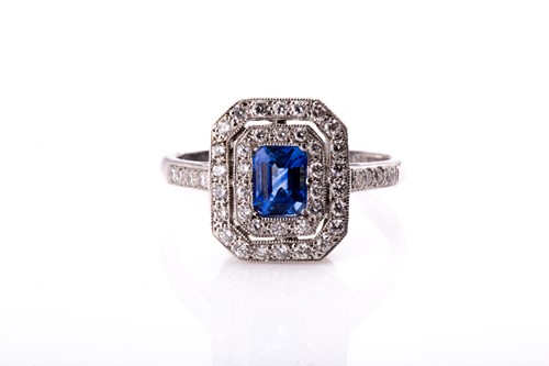 Lot 464 - An 18ct white gold, diamond, and sapphire...