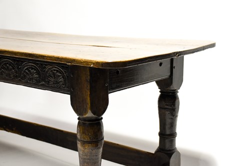 Lot 196 - An early 18th century oak table, the well...