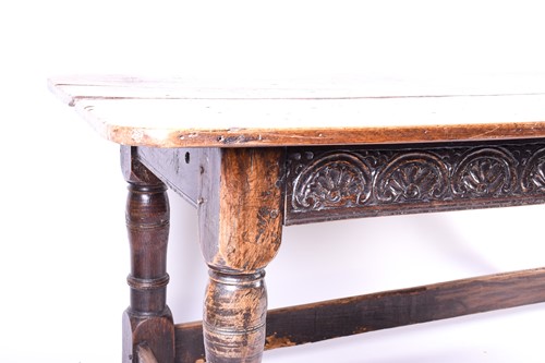 Lot 196 - An early 18th century oak table, the well...