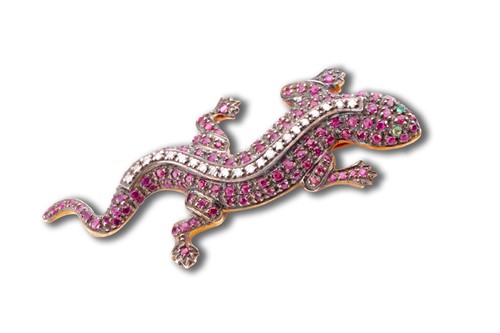 Lot 694 - A silver gilt, diamond, and ruby brooch in the...