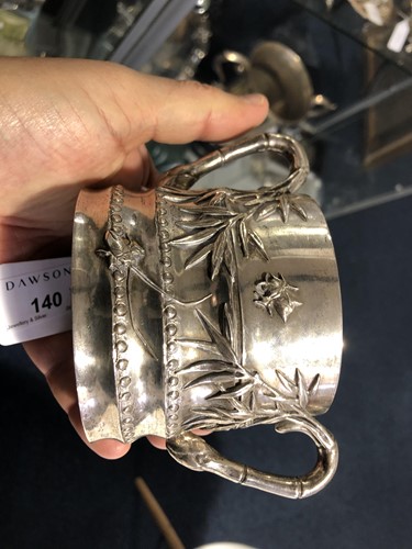 Lot 140 - A Chinese silver tea caddy, sugar bowl and...