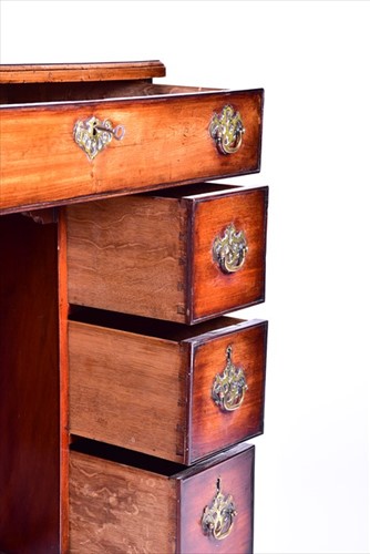 Lot 9 - A George III mahogany kneehole desk the...