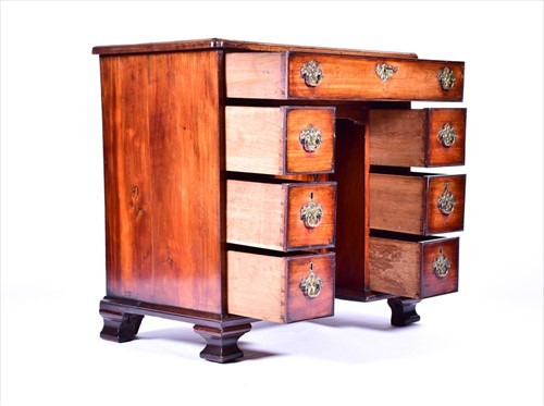 Lot 9 - A George III mahogany kneehole desk the...