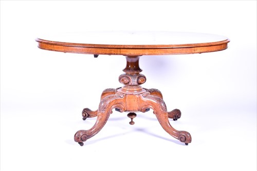 Lot 38 - A Victorian figured walnut oval loo table the...