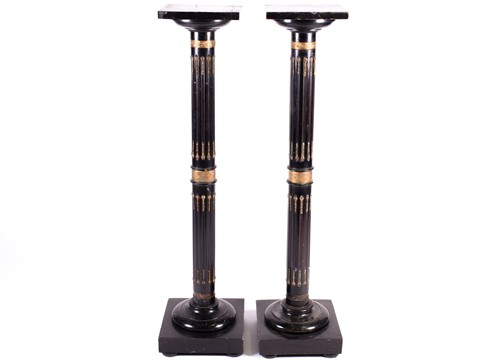 Lot 183 - A pair of aesthetic ebonised torcheres, late...