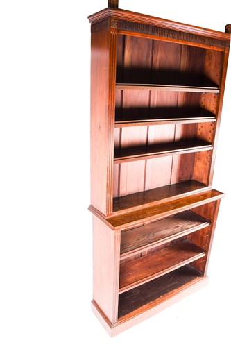 Lot 138 - An Arts and Crafts mahogany double bookcase,...